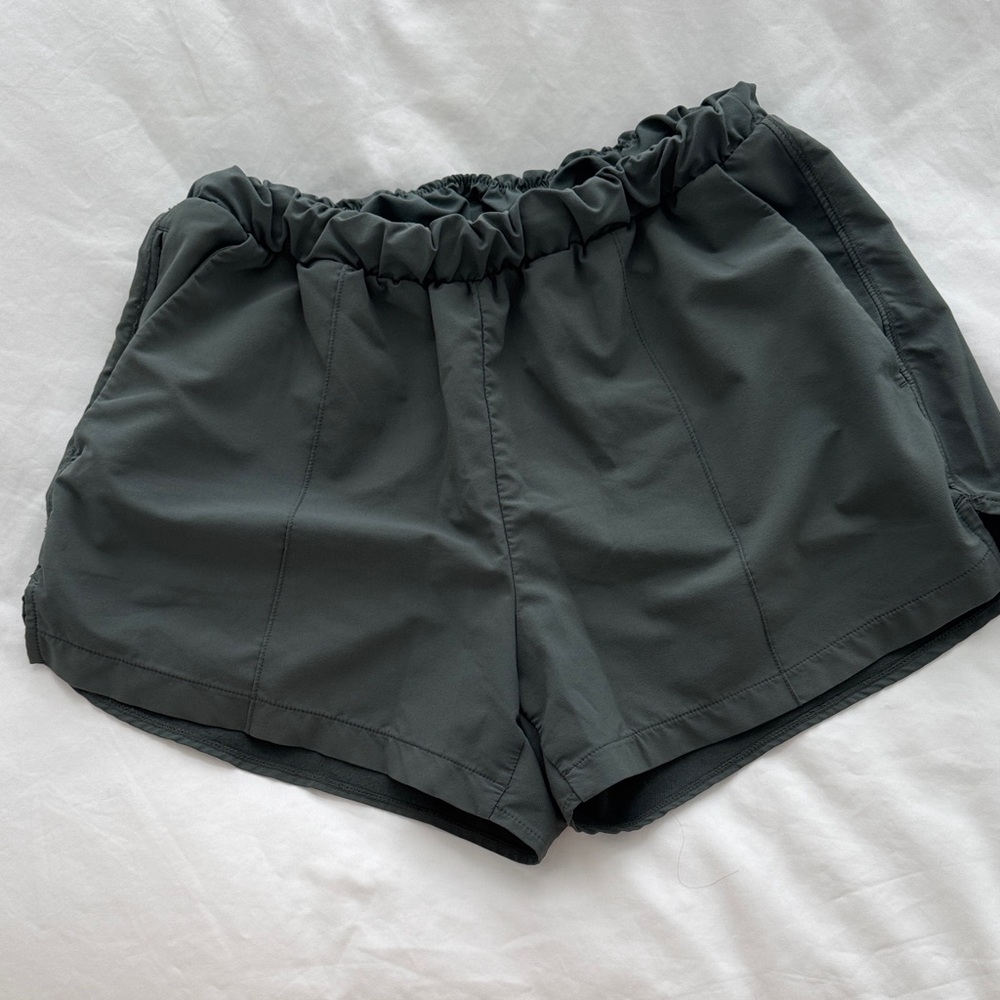 Zella Dark Green Athletic Shorts with zip pocket and style details